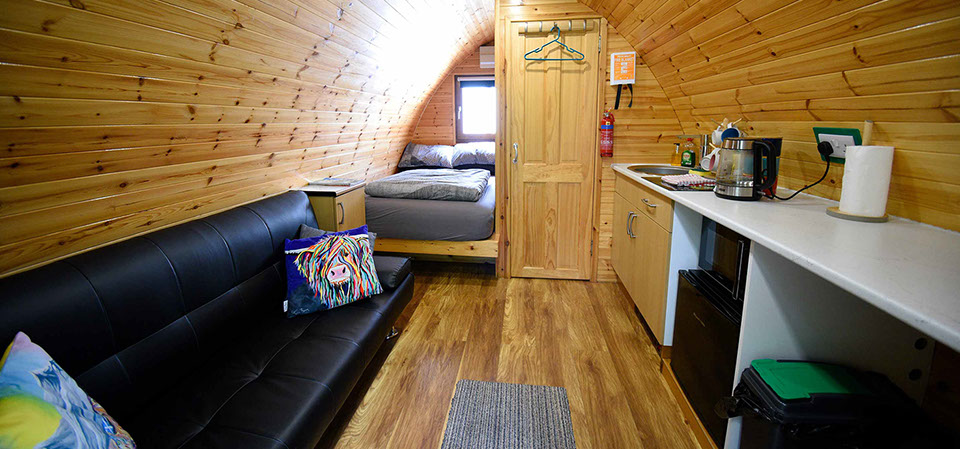Our self catering Pods contain comfortable double bed en suite shower room comfortable seat and WIFI internet